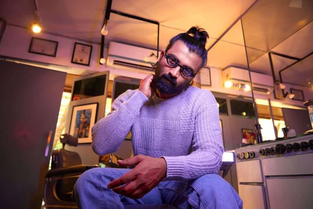 Darshan Yewalekar in barbershop, Indian celebrity hair stylist, redefining barber culture