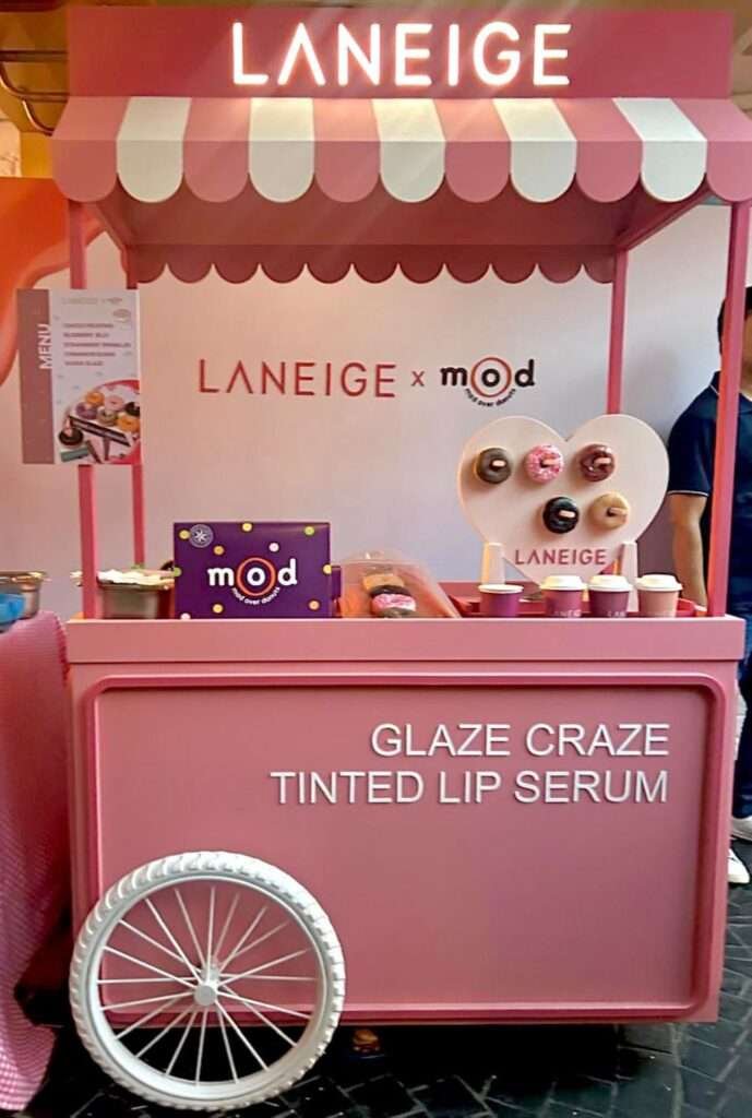 Laneige x Mad Over Donuts pop-up booth with branded decor and display menu