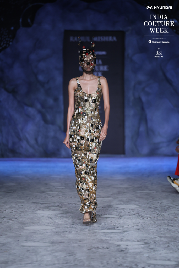 Model in mirror-embellished gown with mask by Rahul Mishra at ICW 2025